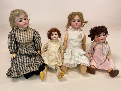 Lot 212 - A collection of four dolls comprising a...