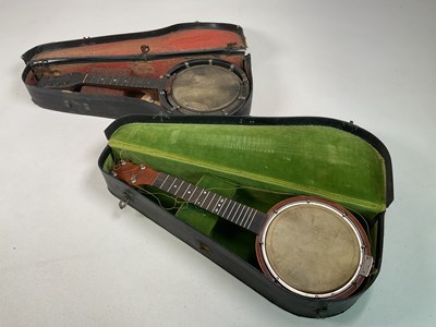 Lot 255 - Two vintage banjos in cases, comprising a...