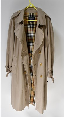 Lot 468 - BURBERRY; a tan overcoat with tartan liner,...