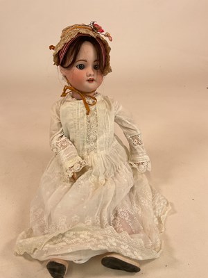 Lot 186 - SFBJ; a bisque head doll with moving glass...