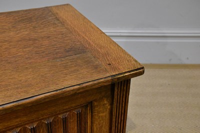 Lot 1077 - An reproduction oak blanket box on square legs,...