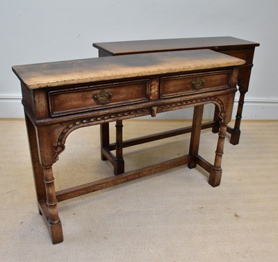 Lot 1066 - A near pair of reproduction oak two drawer...