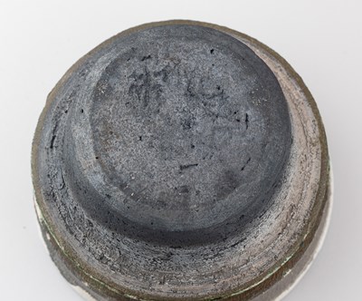 Lot 94 - CHRIS JENSEN; a large porcelain bowl covered...