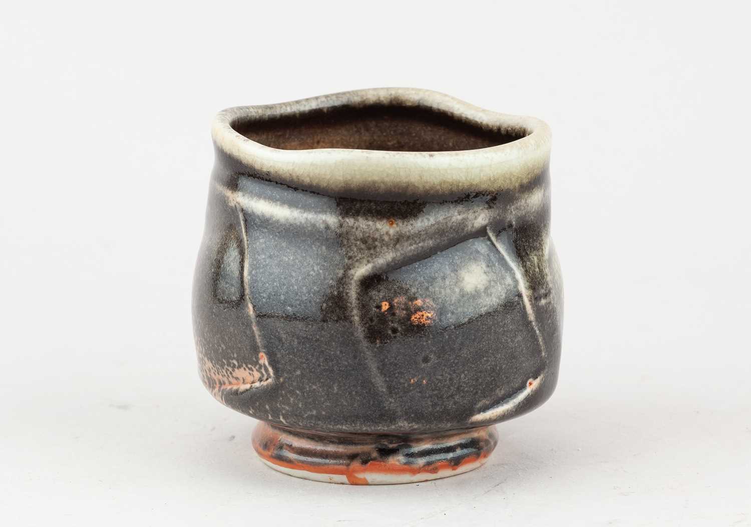 Lot 233 - JACK TROY (born 1938); a faceted porcelain...