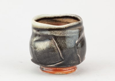 Lot 233 - JACK TROY (born 1938); a faceted porcelain...