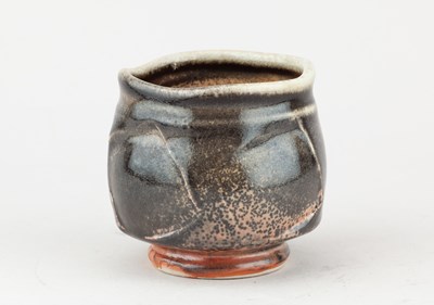 Lot 233 - JACK TROY (born 1938); a faceted porcelain...