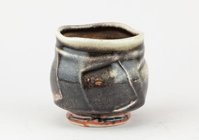Lot 233 - JACK TROY (born 1938); a faceted porcelain...