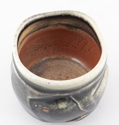 Lot 233 - JACK TROY (born 1938); a faceted porcelain...