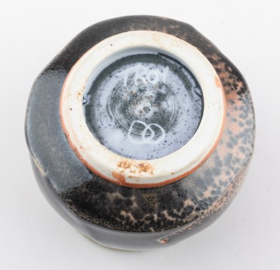 Lot 233 - JACK TROY (born 1938); a faceted porcelain...
