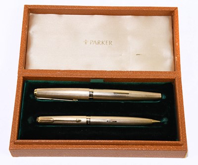 Lot 62 - PARKER; a 9ct gold cased fountain pen with 14K...
