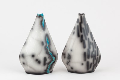 Lot 608 - SUSAN LUKER; a near pair of raku barnacle...