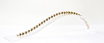 Lot 774 - A 9ct gold belcher link bracelet with swivel...