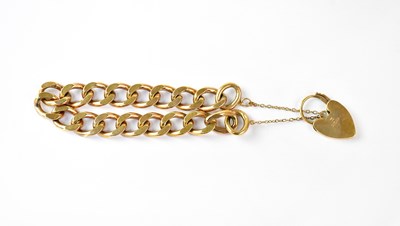 Lot 778 - A 9ct gold curb link bracelet, with 9ct gold...