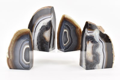 Lot 422 - Two pairs of polished agate bookends, heights...