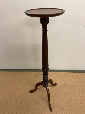 Lot 754 - A mahogany torchere, height 108cm.