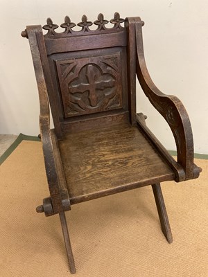 Lot 755 - A carved oak Glastonbury ecclesiastical chair,...