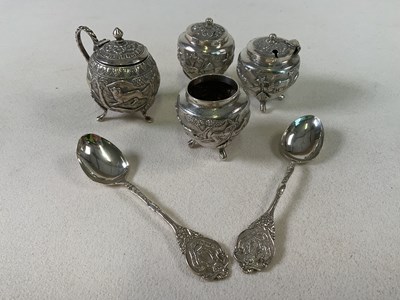 Lot 467 - An Indian white metal four piece cruet, each...