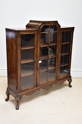 Lot 1067 - A 1930s walnut display cabinet with three...