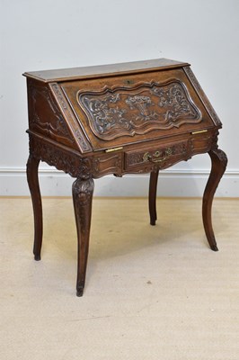 Lot 1170 - A 19th century Dutch carved oak bureau, with...