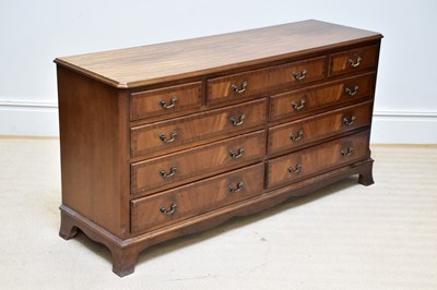 Lot 1046 - A reproduction mahogany chest of nine drawers,...