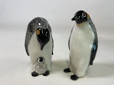 Lot 311 - WINSTANLEY; a pair of penguins with glass eyes,...