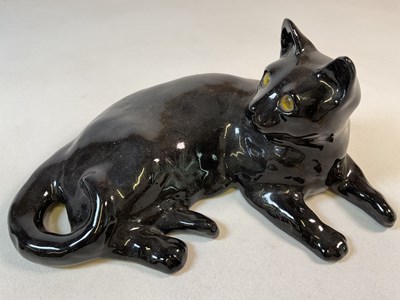 Lot 312 - WINSTANLEY; a large recumbent black cat with...