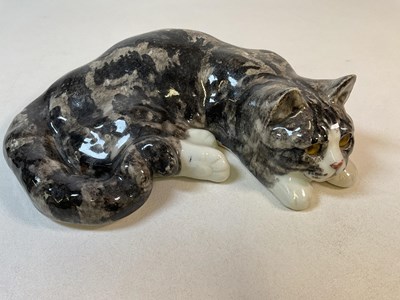 Lot 313 - WINSTANLEY; a size 6 recumbent tabby cat,...