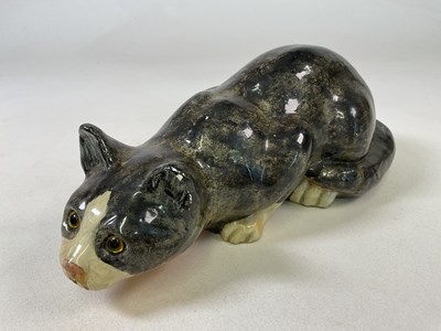 Lot 315 - WINSTANLEY; a large early crouching tabby cat...