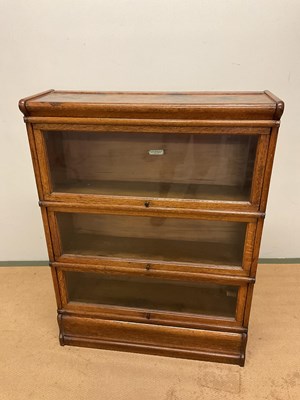 Lot 710 - GLOBE WERNICKE; a bookcase in five parts, base,...