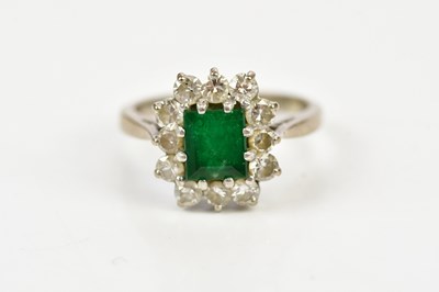 Lot 53 - An 18ct white gold and platinum emerald and...