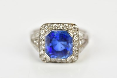 Lot 26 - A white metal diamond and sapphire dress ring...