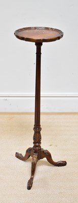 Lot 1129 - A reproduction mahogany plant stand with...