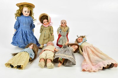 Lot 89 - A collection of bisque headed miniature dolls...