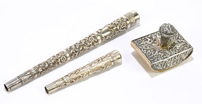 Lot 2533 - Two Indian white metal parasol handles, the...
