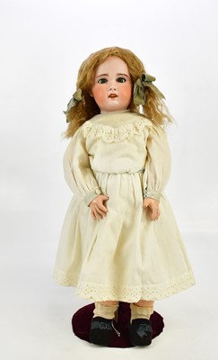 Lot 62 - SFBJ; a French bisque headed doll with painted...