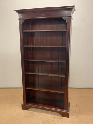 Lot 750 - A reproduction dark wood bookcase with five...