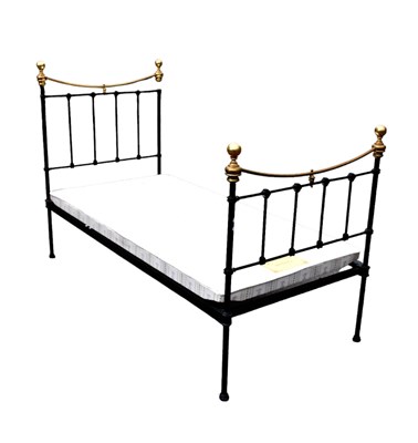 Lot 1153 - A 20th century single black painted metal bed...