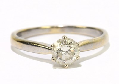 Lot 1193 - An 18ct white gold diamond solitaire ring, the...