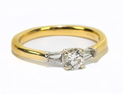 Lot 1041 - An 18ct yellow gold diamond three stone dress...