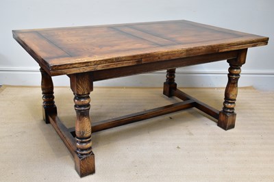 Lot 1042 - RACKSTRAW; a good reproduction oak draw-leaf...