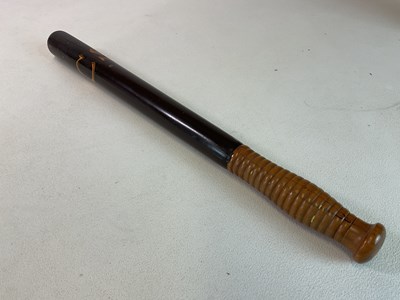 Lot 60 - An early 19th century painted wooden truncheon...