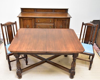 Lot 1200 - An early 20th century oak dining suite...