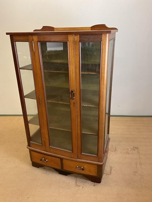 Lot 778 - A glazed cabinet over two drawers, 140 x 81 x...