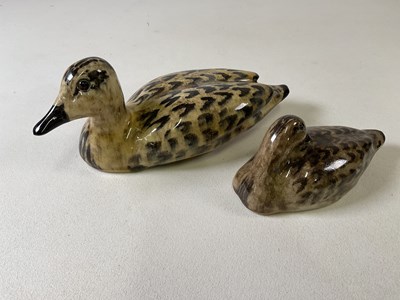 Lot 317 - WINSTANLEY; two ceramic ducks in brown mottled...