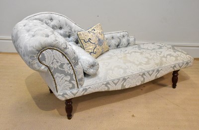 Lot 1073 - A reproduction chaise longue on turned legs,...