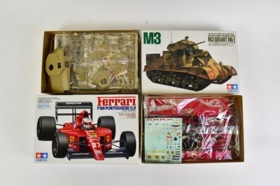 Lot 146 - TAMIYA; a collection of six model tank kits to...