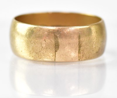 Lot 854 - A 9ct yellow gold wide wedding band, size Z+1,...