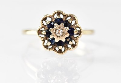 Lot 869 - A 9ct yellow gold floral cluster ring set with...