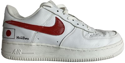 Lot 25 - NIKE; a pair Air Force 1 white leather...