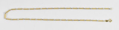 Lot 743 - An 18ct yellow and white gold necklace, length...